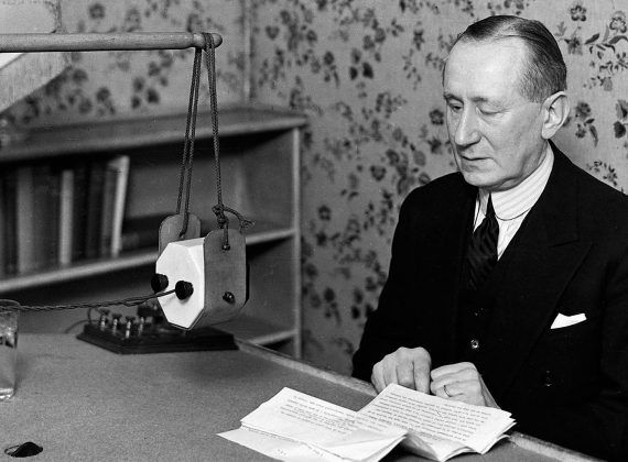 Guglielmo Marconi as seen at the microphone in December 1929 when he was a Senator in the then Senate of the Kingdom of Italy. Image: ©BBC 1929.